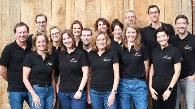 Groepsfoto van de coaches